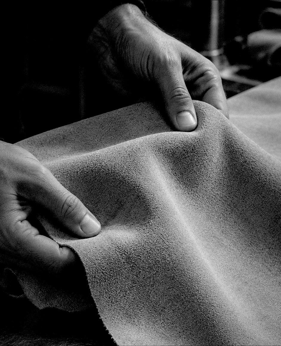 Inspecting a suede hide by hand